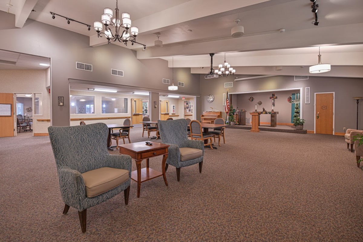 Spacious lobby with comfortable seating and elegant chandeliers.