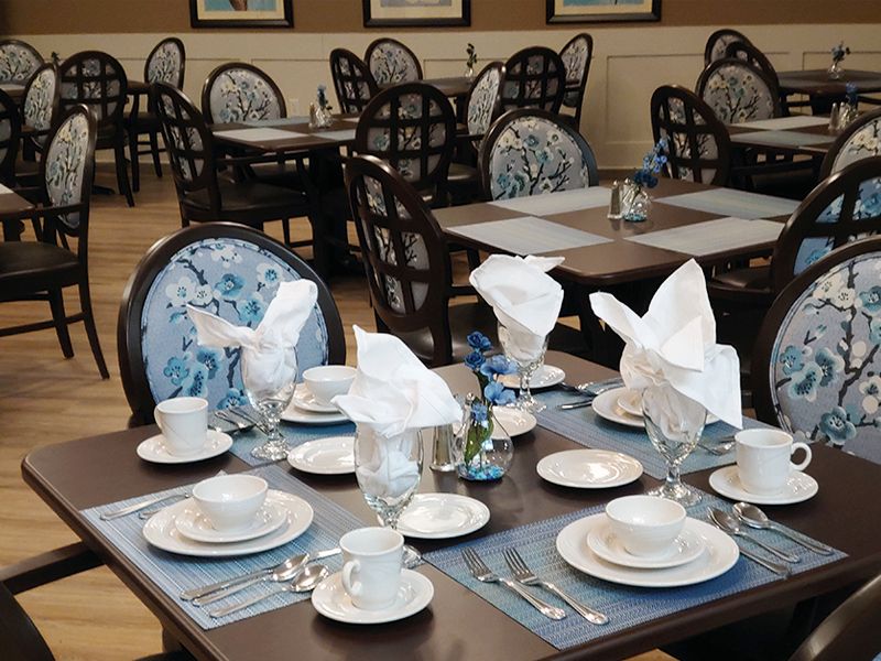 An elegantly set dining table in a restaurant.