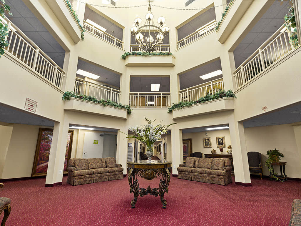 A spacious atrium lobby with elegant furnishings and architectural details.