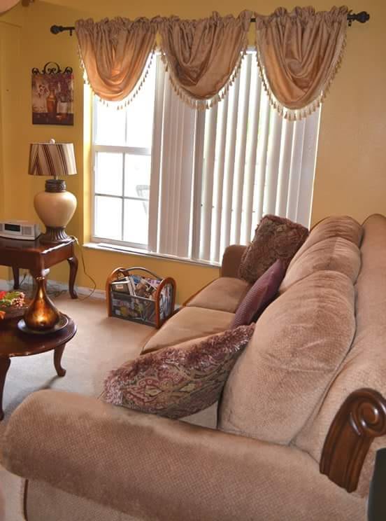 Cozy living room with a large sofa and elegant decor.