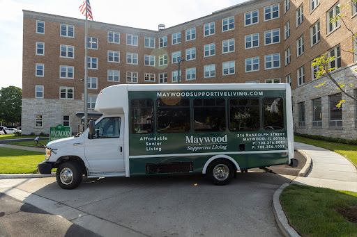 A shuttle bus parked near a residential building, showcasing its service offerings.