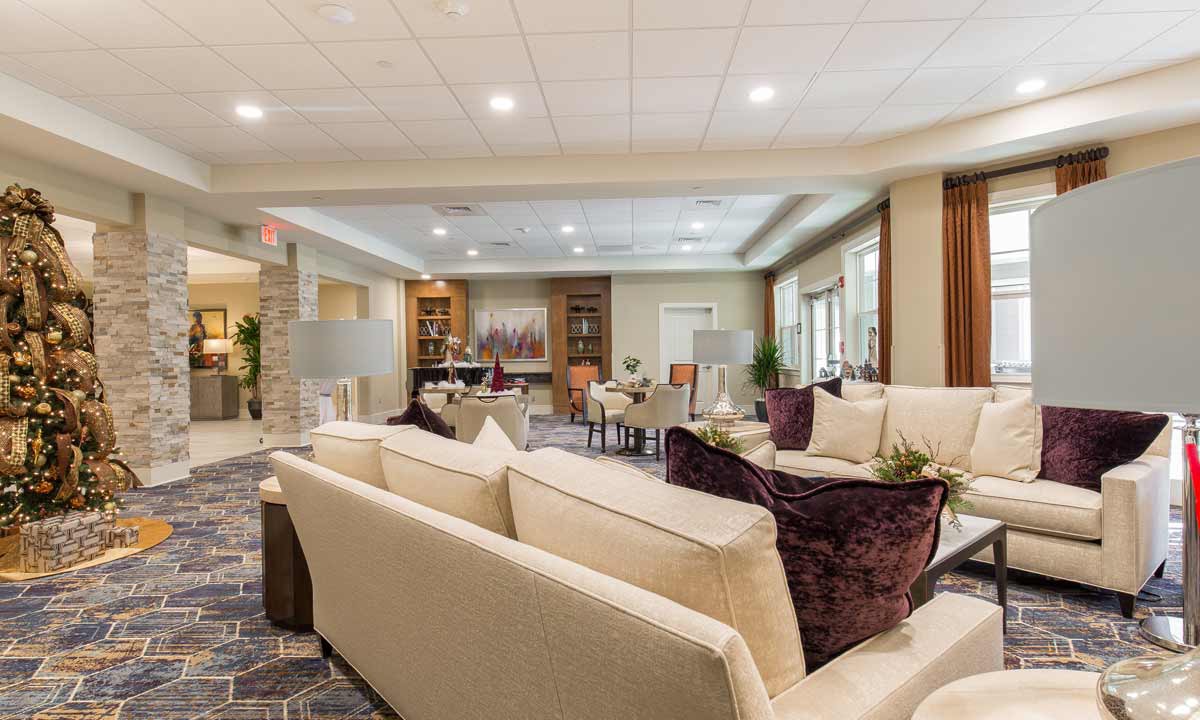 A modern and comfortable lounge area with sofas and accent lighting.