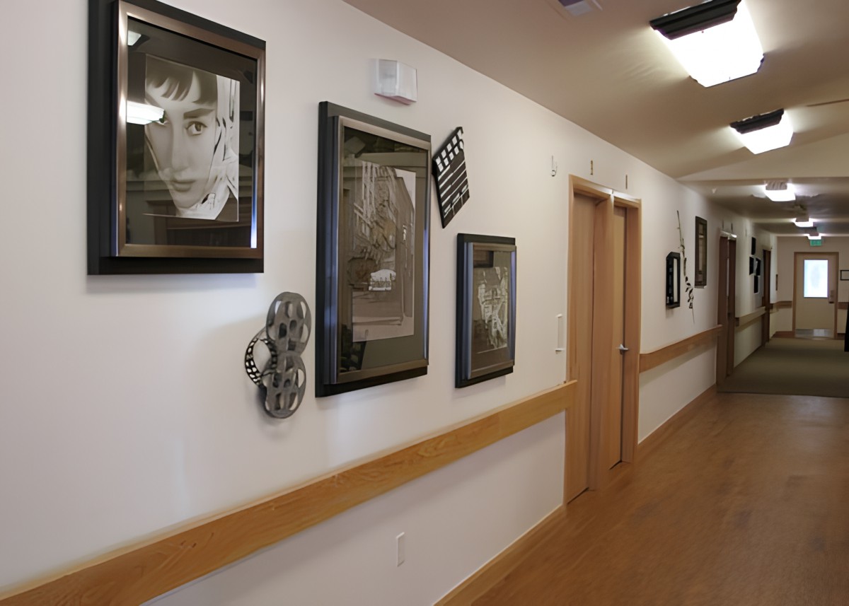 A hallway adorned with framed photographs and artwork.