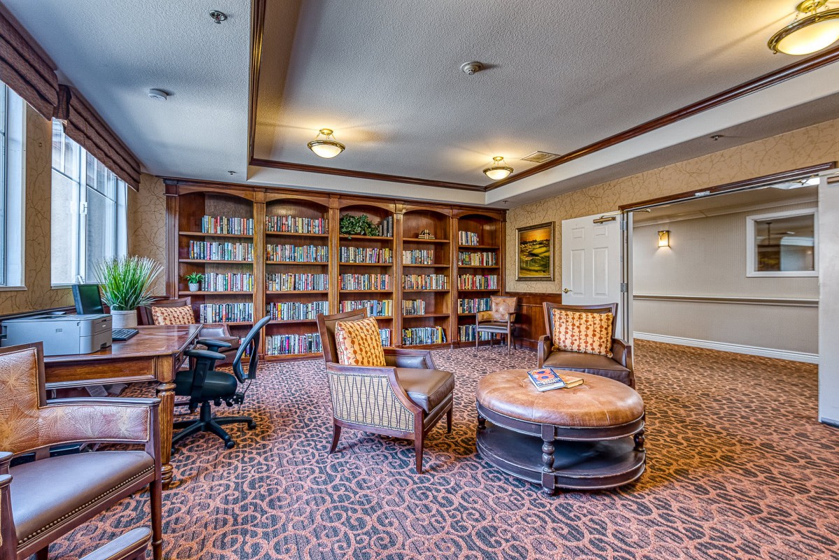 Cozy library with bookshelves and comfortable seating.
