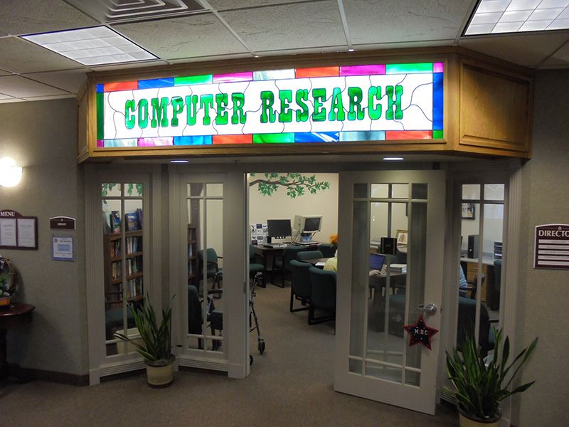 Entrance to a computer research office with colorful signage.