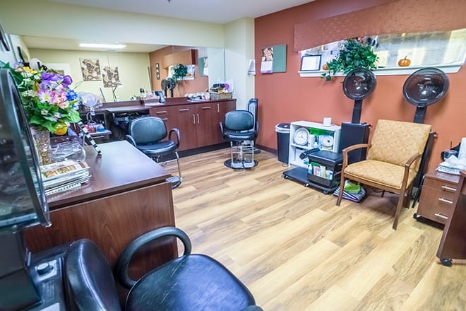 A cozy hair salon interior with styling chairs and mirrors.