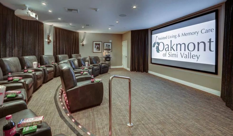 A cozy home theater setup with comfortable seating and a large screen.