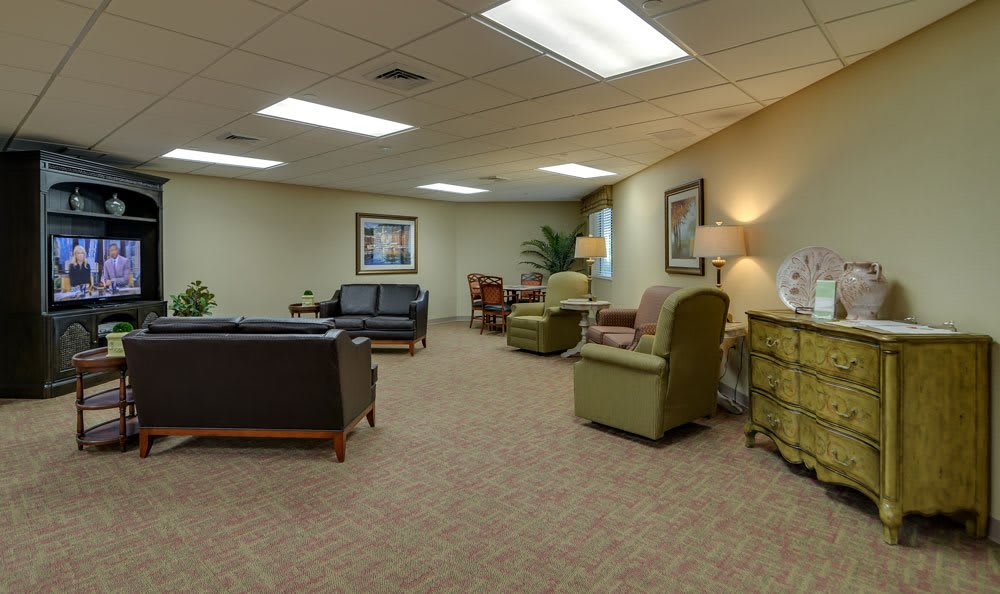 A spacious waiting room with comfortable seating and soft lighting.