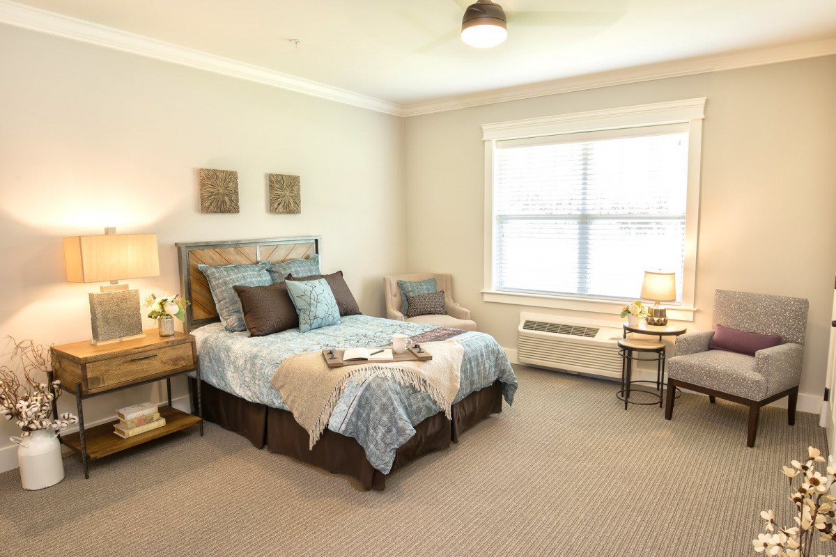 A cozy and elegantly designed bedroom with soft lighting.
