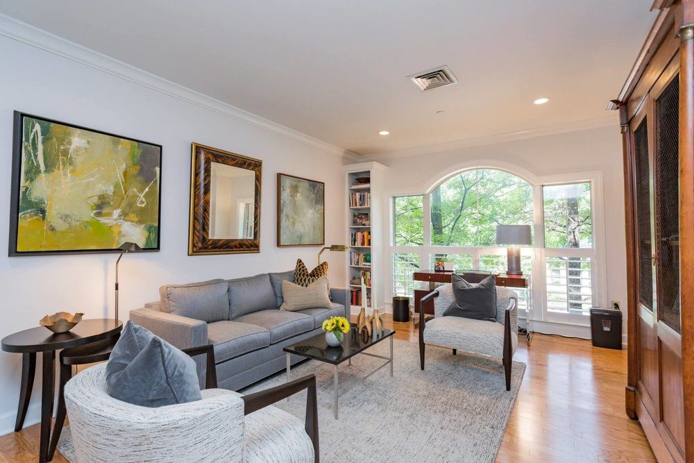 A modern living room with stylish furniture and abundant natural light.