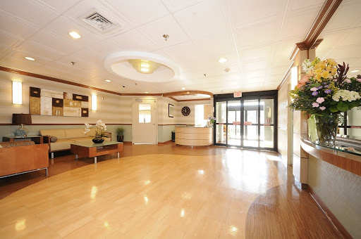 A spacious and welcoming lobby with modern furnishings and ample natural light.