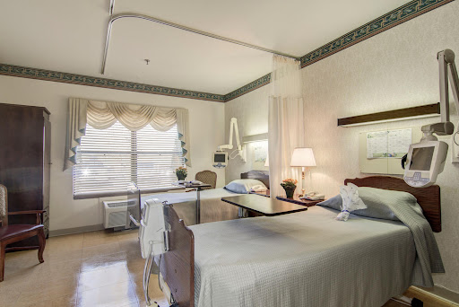 A serene and well-furnished hospital room designed for patient comfort.