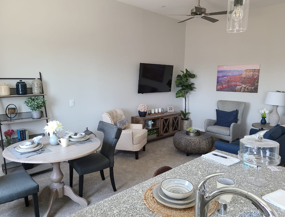 Modern living space with a cozy seating area, dining table, and stylish decor.