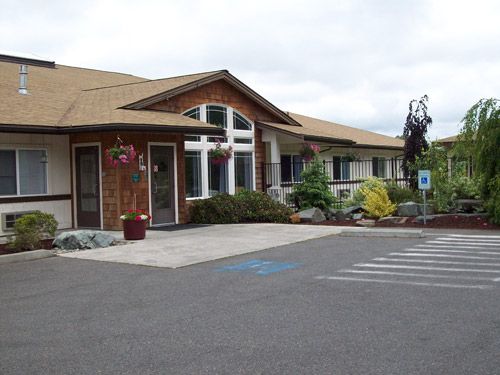 A well-maintained building with a welcoming entrance and designated accessible parking spaces.