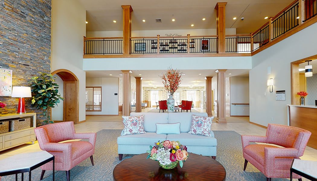Spacious and elegantly designed living room with modern furniture and decor.