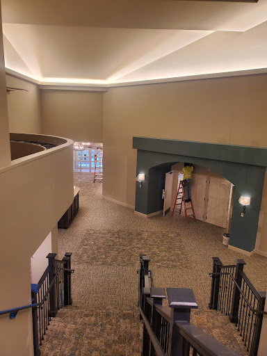 A spacious and well-lit lobby area featuring elegant architectural elements.