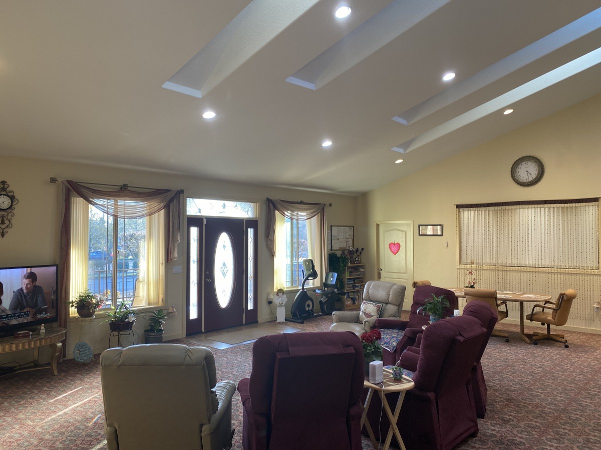 A cozy living room with comfortable seating and warm lighting.