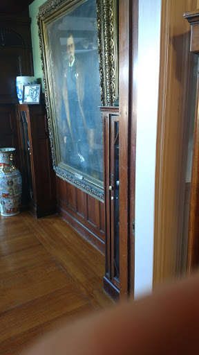 A glimpse of an elegant interior featuring wooden paneling and decorative art.