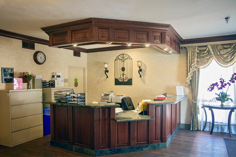 A welcoming reception area with a wooden counter and decorative elements.