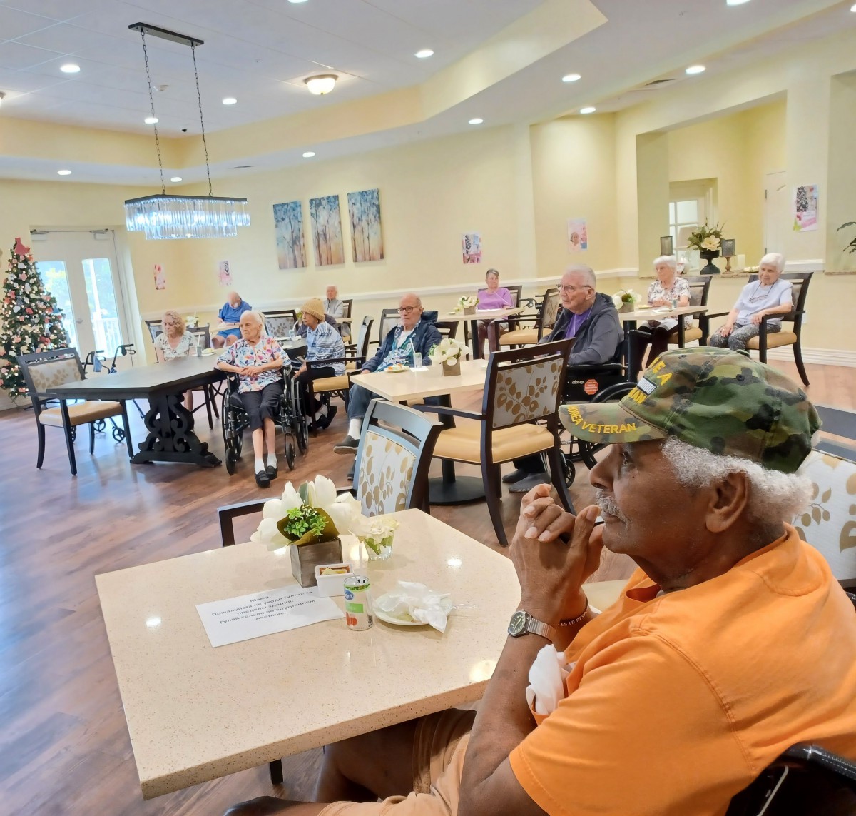 A group of seniors gathered in a communal area for a social event.