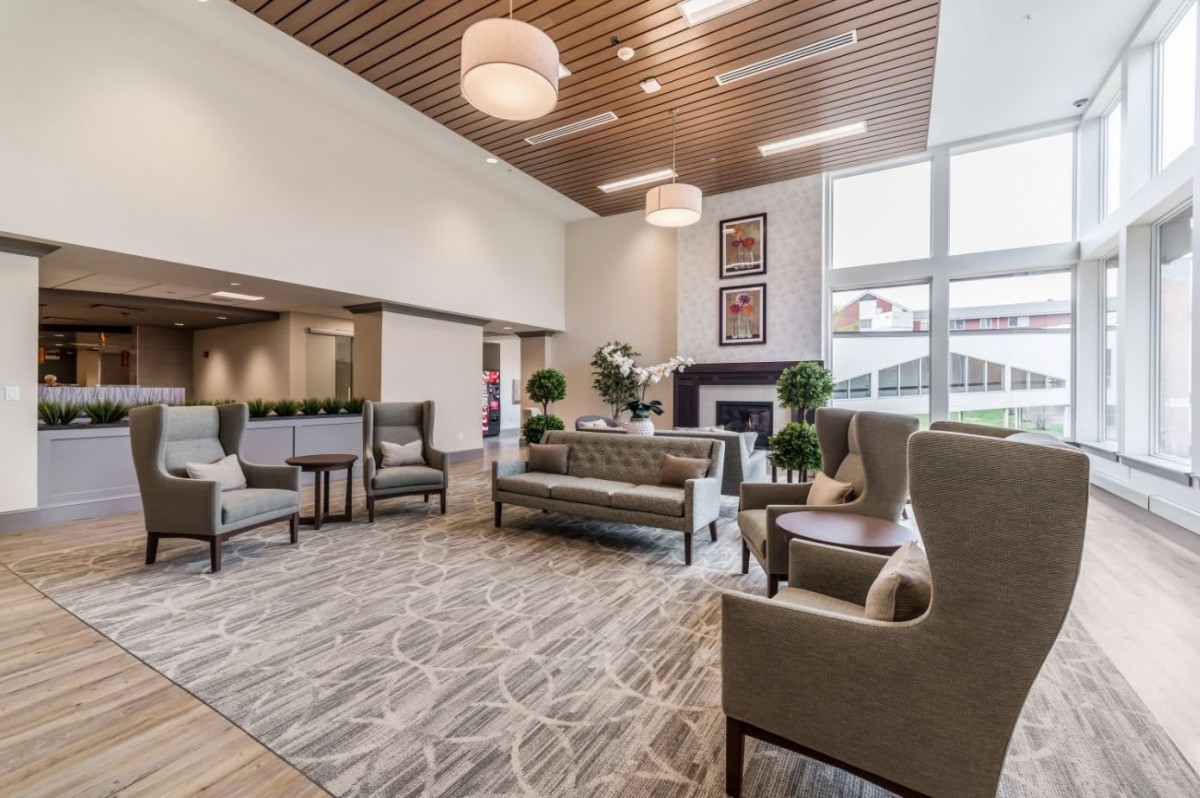 A modern lobby with stylish furniture and lighting.