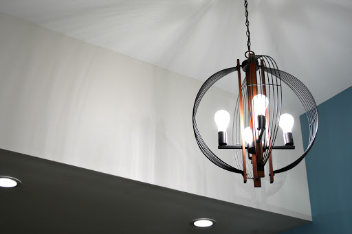 A stylish chandelier with multiple light bulbs, enhancing the modern interior.