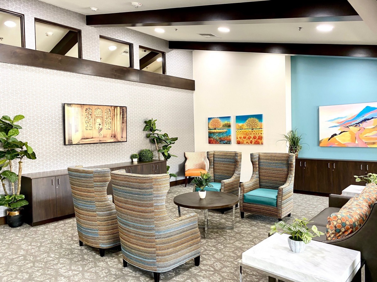 A modern lobby with comfortable seating and vibrant artwork.