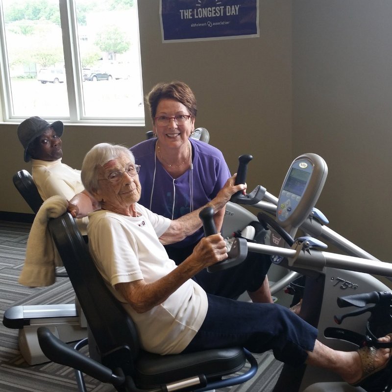 Seniors participating in a community fitness session at the gym.