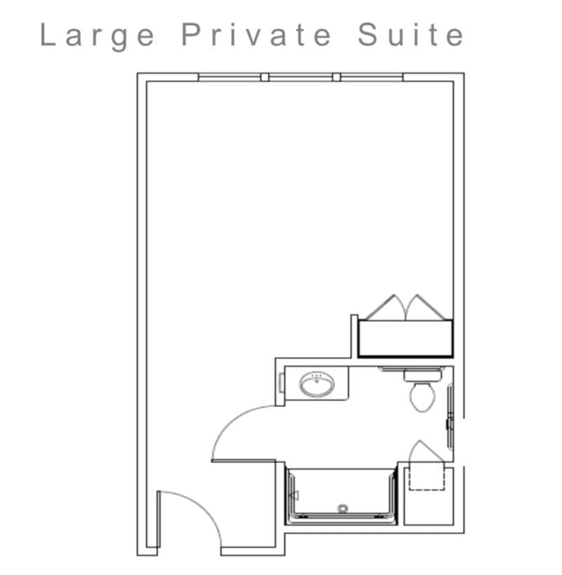 A floor plan of a large private suite showing the layout including a bed, bathroom, and entrance.