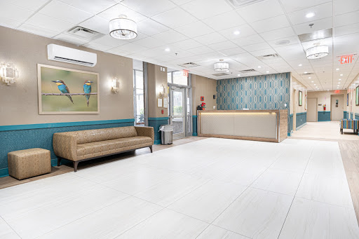 A modern and inviting lobby with a reception desk and comfortable seating.