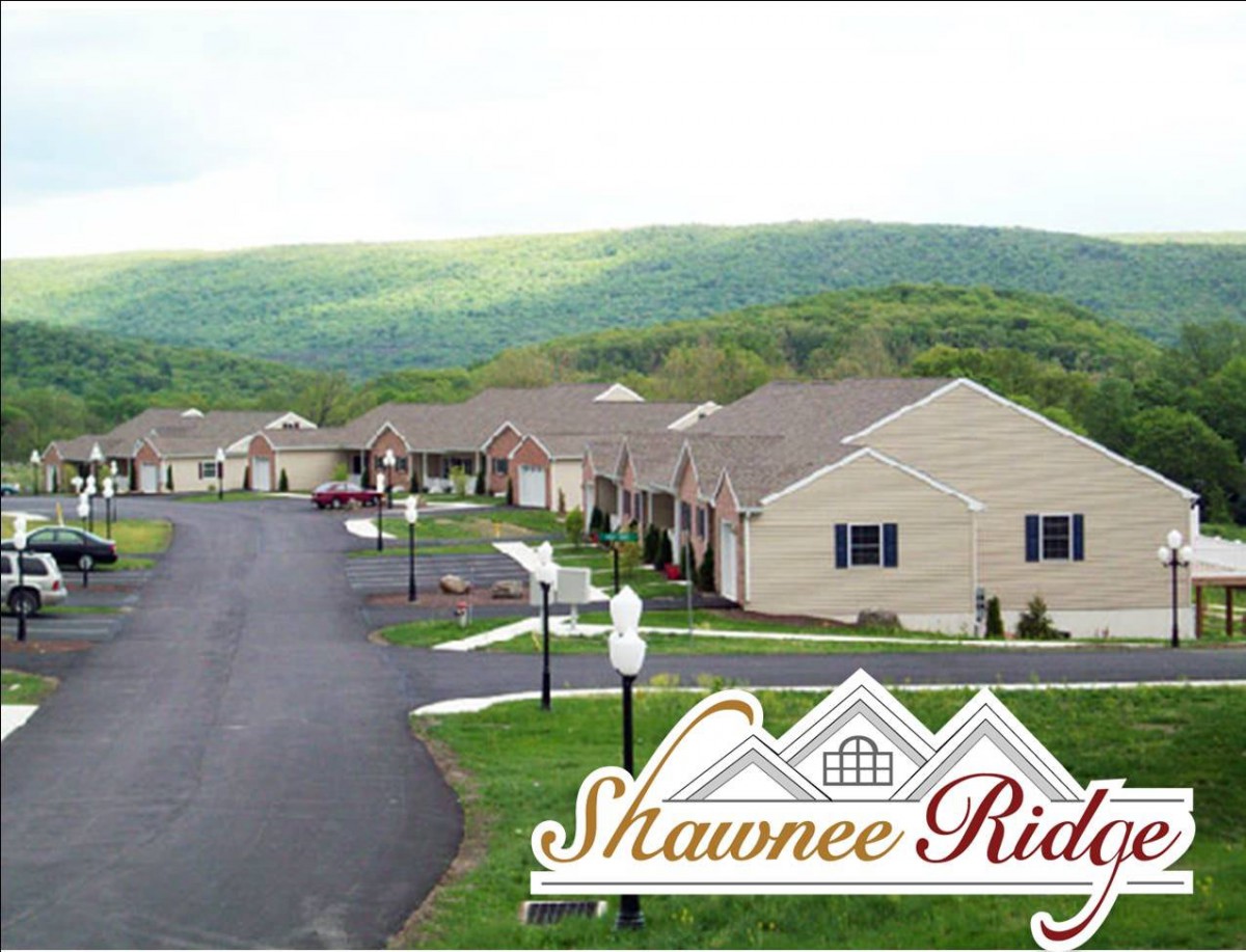 A scenic view of the Shawnee Ridge housing community nestled in a mountainous landscape.