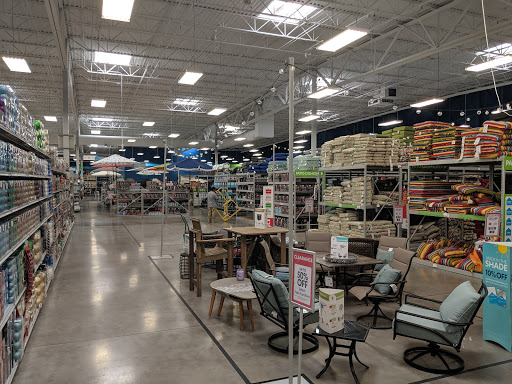 An interior view of a retail store showcasing various products and furniture on display.