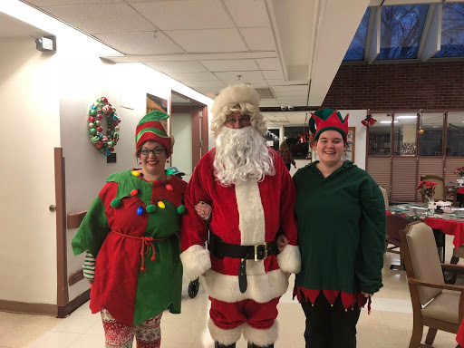 A festive gathering with Santa and two elves, spreading holiday cheer!