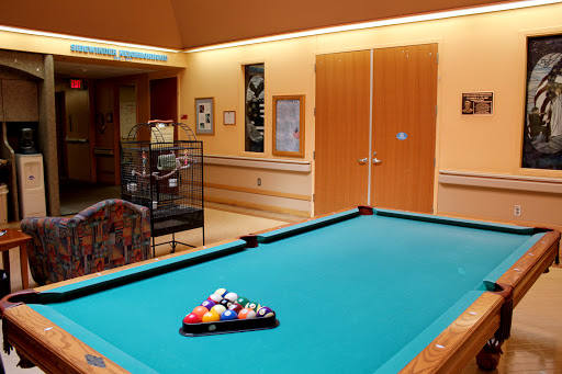A recreational space featuring a pool table ready for a game.