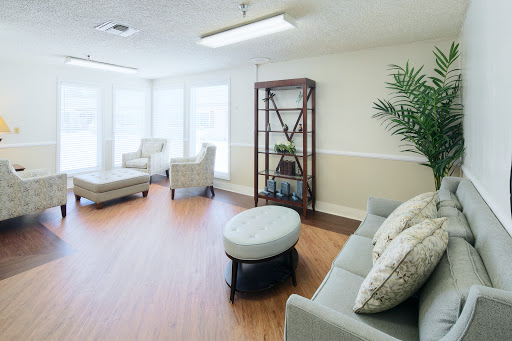 A bright and inviting lounge area featuring comfortable seating and modern decor.