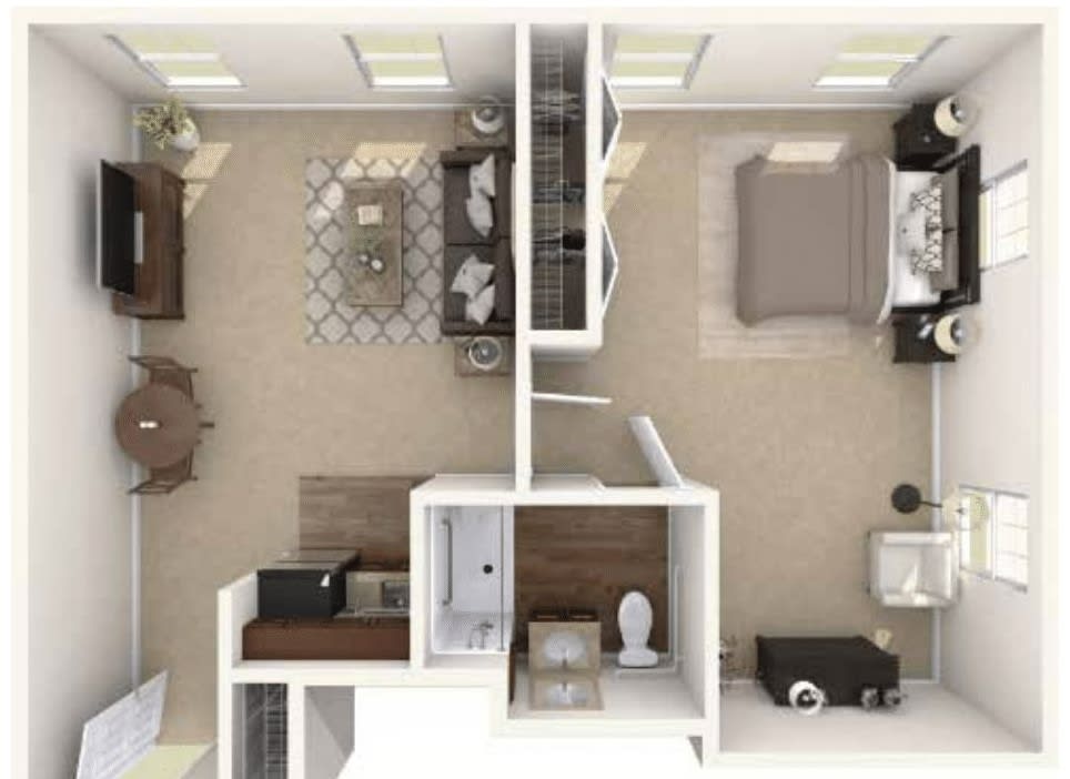 A top view of an apartment floor plan showing the living room, bedroom, kitchen, and bathroom.