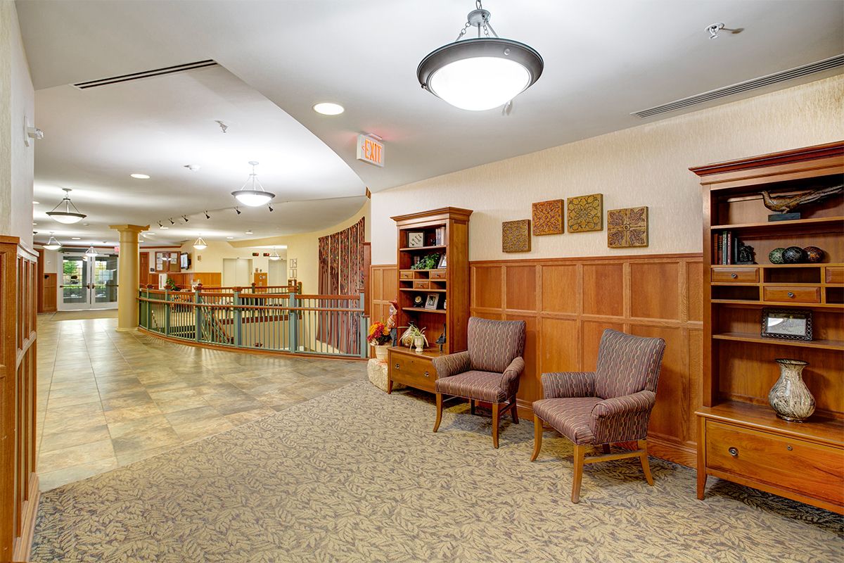 A well-lit hallway with comfortable seating and decorative elements.