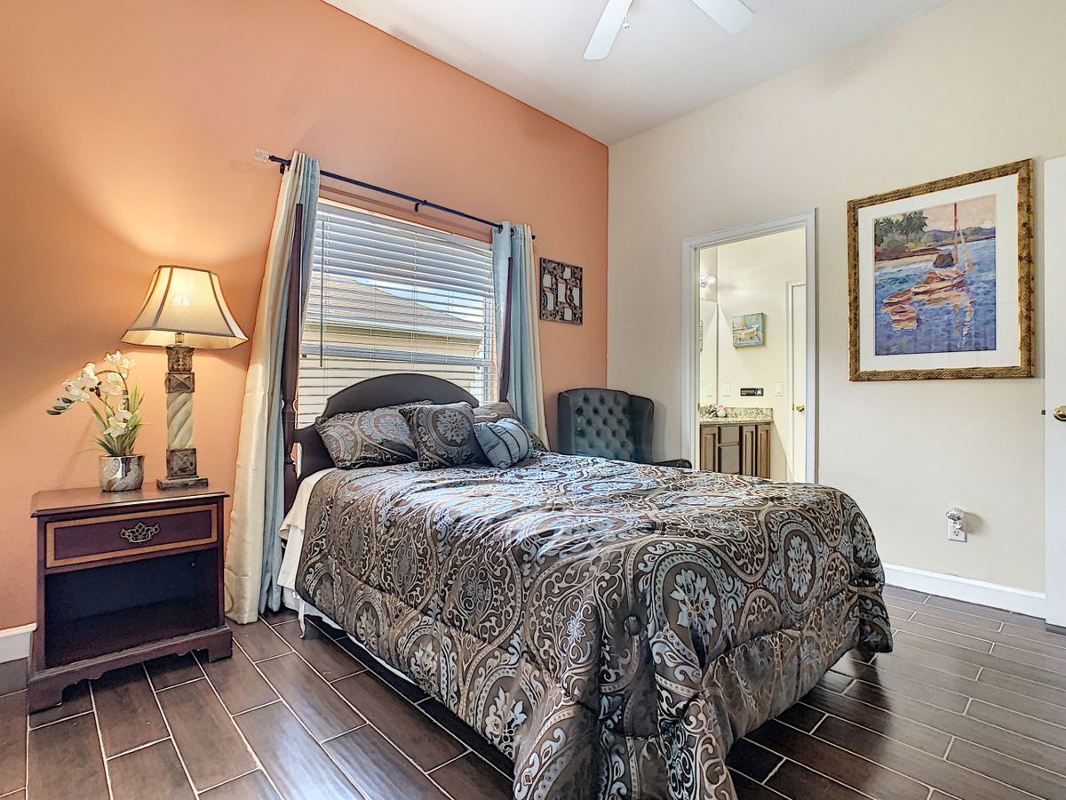 A cozy bedroom with elegant decor and a comfortable bed.