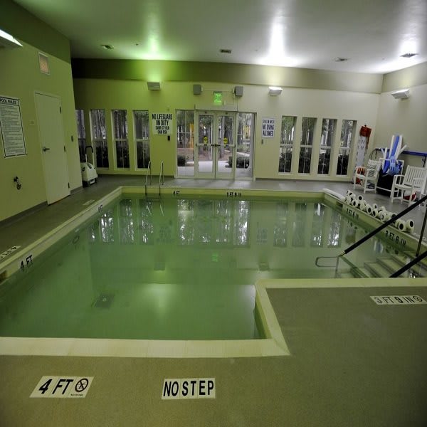 An indoor swimming pool with a calm ambiance.