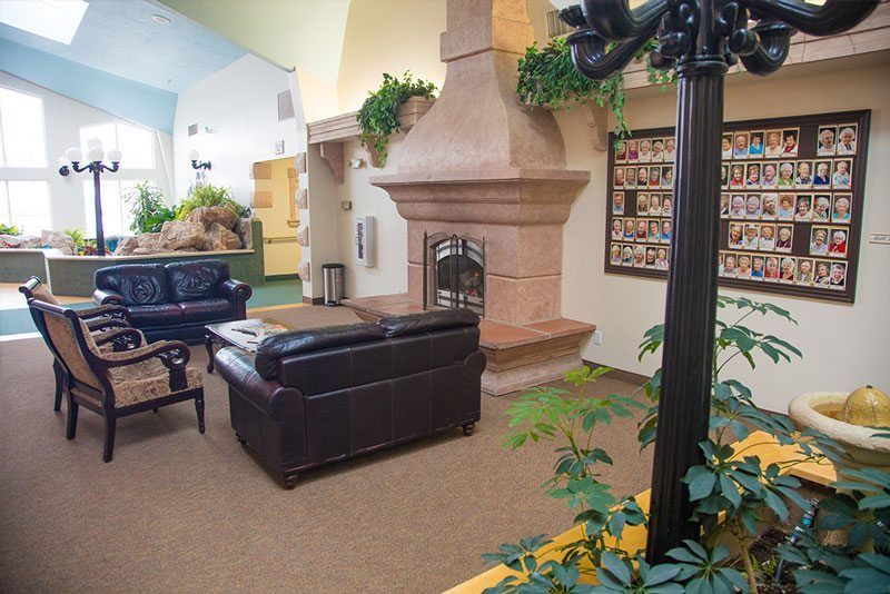 A cozy lobby with a fireplace and comfortable seating.