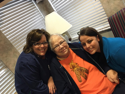 A heartwarming moment shared between three generations, capturing joy and togetherness.