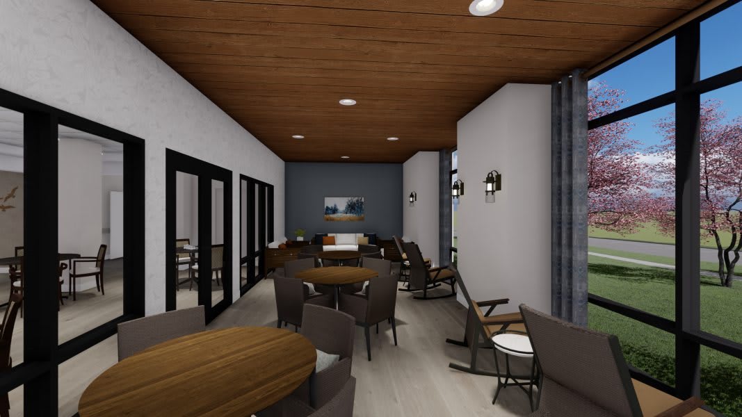 A modern dining area with a wood ceiling and stylish furniture.