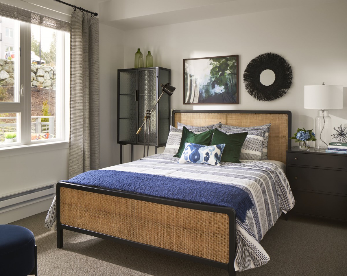 A cozy bedroom with stylish decor and a comfortable bed.