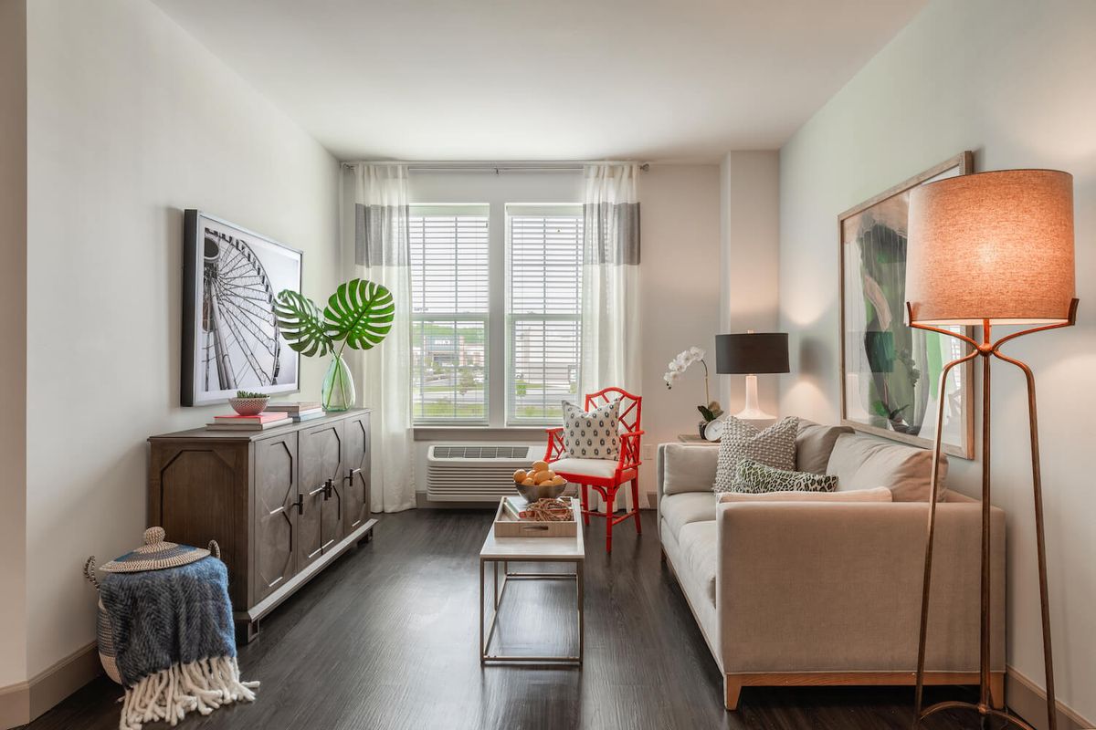 A bright and modern living room with stylish furniture and decor.