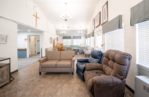 A bright and welcoming living room with cozy seating and a spacious layout.