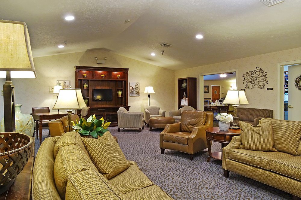 A cozy living room with comfortable seating and warm lighting.