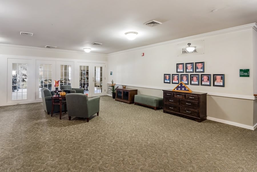 A spacious living room with comfortable seating and decor.