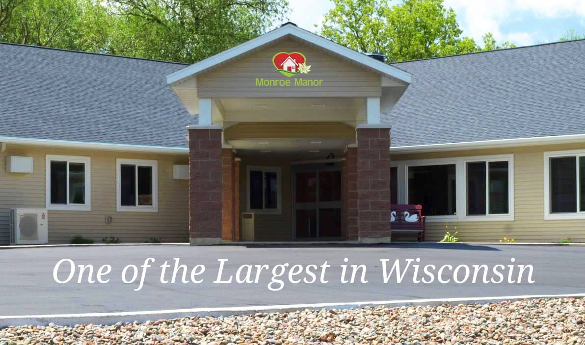 A large building entrance surrounded by trees, located in Wisconsin.
