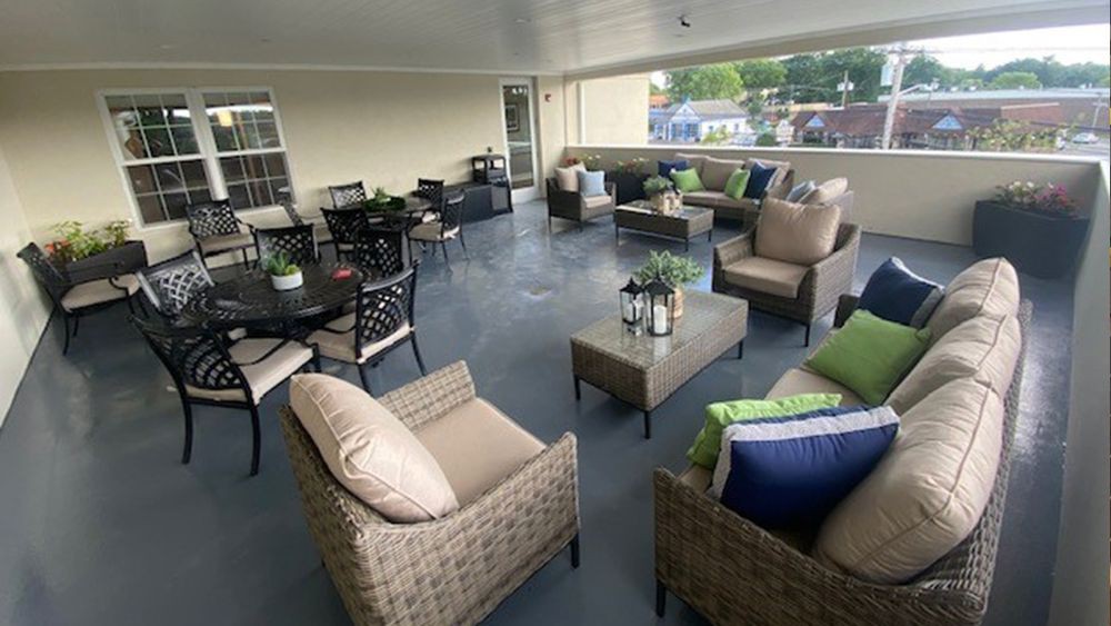 A spacious outdoor patio with comfortable seating and decor.