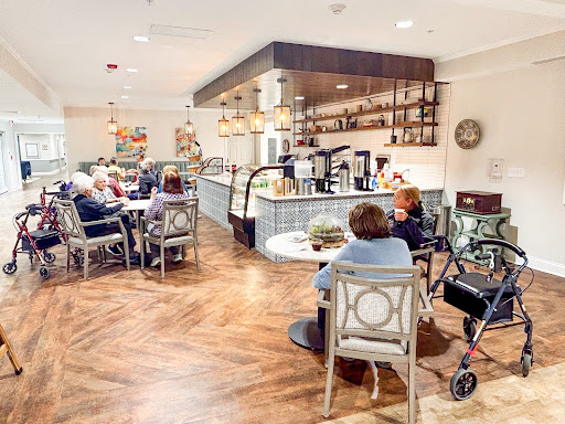 A cozy caf setting where elderly individuals gather to socialize and enjoy refreshments.
